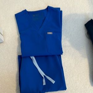 Figs in Black, Navy, Gray and Colbolt Blue. Size XXS for tops and XXS/P bottoms.